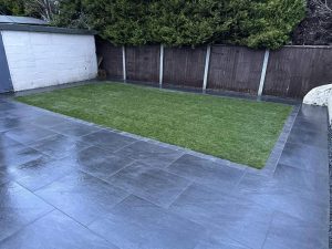 Newly laid patio and fresh lawn by GND Landscaping & Building in Harwich, UK, showcasing expert landscaping and garden design services.